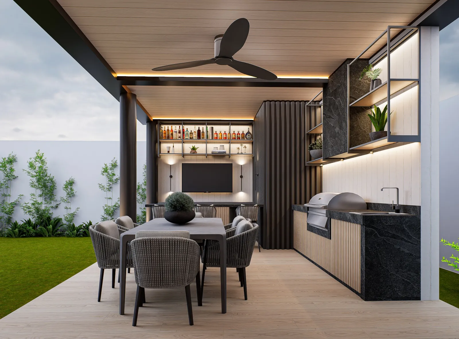 Espacio exterior cubierto con zona de comedor, cocina y entretenimiento integradas bajo pergola moderna.
