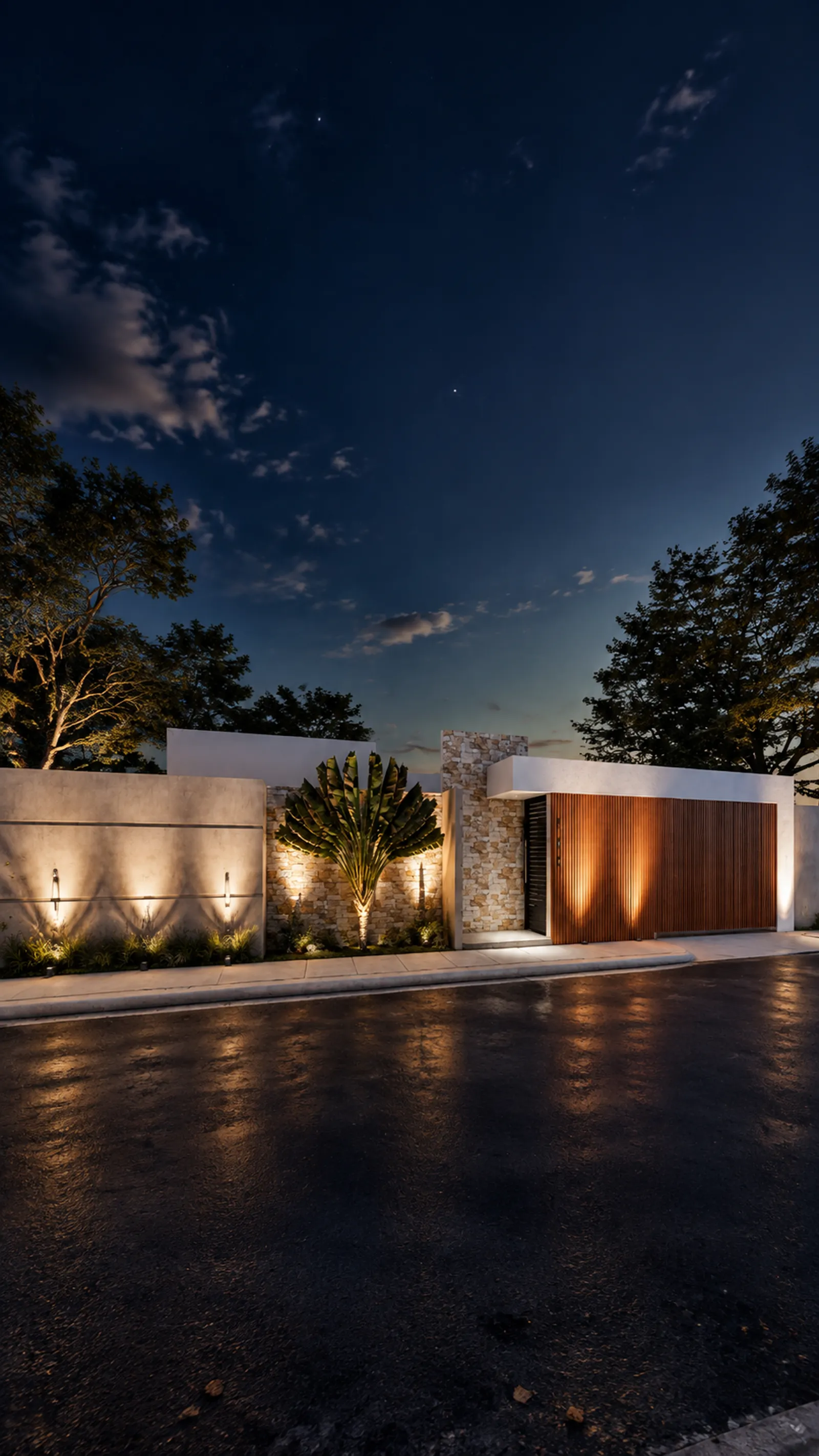 Vista vertical de fachada moderna al anochecer con muro de piedra iluminado, portón de madera y palma decorativa.